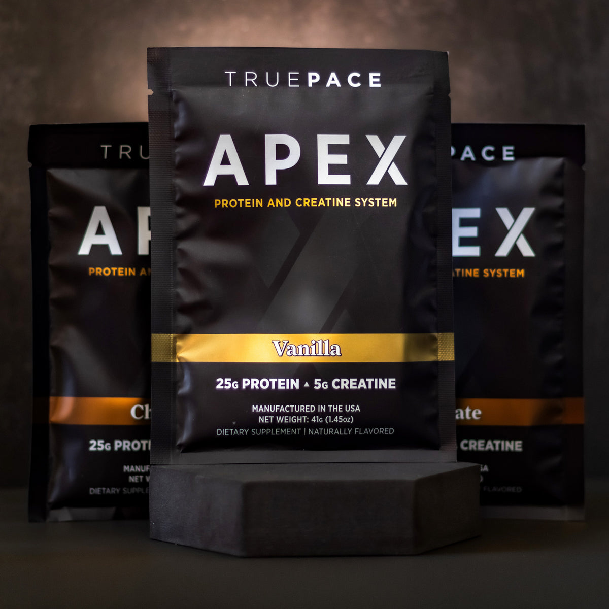 truePACE APEX Mixed pack of Vanilla and Chocolate protein and creatine packets on a dark background