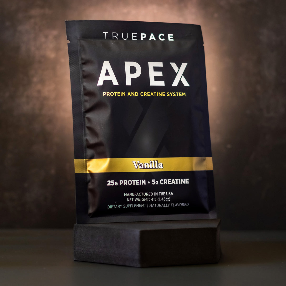truePACE APEX Vanilla single-serve protein and creatine packet, front of pack on a dark background